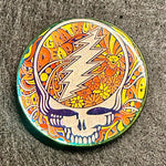 Colorful Grateful Dead logo on a textured surface