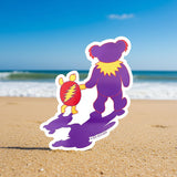 Sticker of two bears holding hands with rainbows in the background