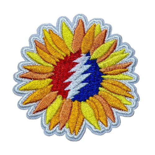 Colorful sunflower-shaped patch with a multicolored center on a brown background