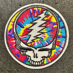Colorful Grateful Dead patch with a skull design on a dark background