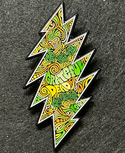 Colorful geometric pin on a dark textured background