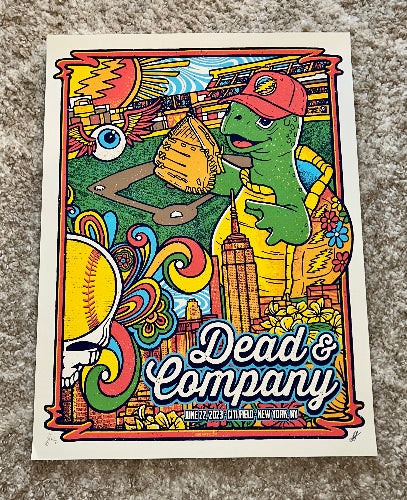 Colorful poster with a cartoon turtle holding a baseball glove, featuring the text 'Dead & Company' on a textured surface.