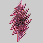 Pink geometric pin with intricate design on a dark gray background