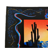 Decorative fabric with a cactus and sunset design on a black background