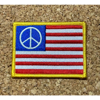 Embroidered American flag patch with peace symbol.