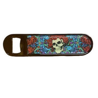 Bottle opener with skull and floral design on a white background