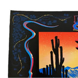 Decorative fabric with a cactus and sunset design on a black background