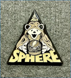 Triangular enamel pin featuring a smiling grateful dead bear in a hooded robe holding a crystal ball with the band’s lightning bolt logo, set against a black background with ’sphere’ lettering in yellow.