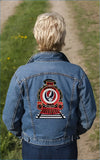 Blue denim jacket featuring a red and black embroidered train design with the grateful dead logo on the back.