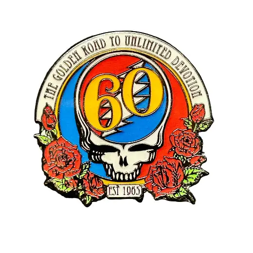 Pin with Grateful Dead logo and text on a textured surface
