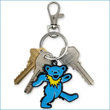 Blue grateful dead dancing bear metal keychain with yellow collar and silver clip for easy attachment