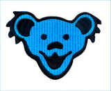 Blue embroidered patch featuring the iconic grateful dead bear head design with black outlining and stitched details.