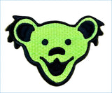 Bright neon green embroidered patch featuring the iconic grateful dead bear head design with black stitched details.