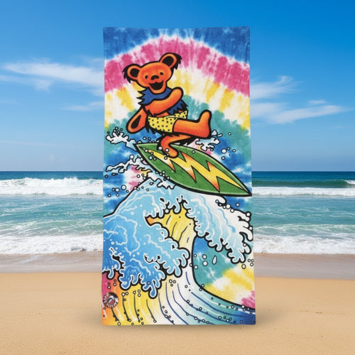 Colorful towel with a bear surfing design on a white background