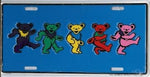 Colorful dancing bear figures on a blue license plate.