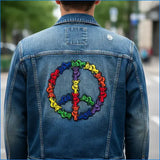 Blue denim jacket featuring a vibrant rainbow-colored embroidered peace sign made of bears.