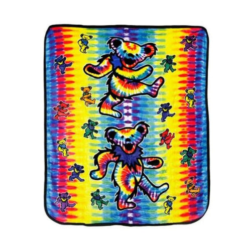Colorful tie-dye blanket with dancing bear design on a white background