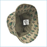 Beige bucket hat adorned with a repeating pattern of green and brown turtles.