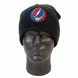 Black knitted beanie featuring a circular embroidered patch with the iconic red, white, and blue grateful dead skull logo.