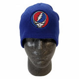 Royal blue knitted beanie featuring a circular embroidered patch with the iconic grateful dead skull and lightning bolt design.