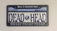 Illinois license plate with ’DEAD HEAD’ text and Grateful Dead imagery.