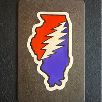 Sticker depicting Illinois state outline filled with red and blue colors separated by a white lightning bolt design.