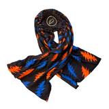 Colorful patterned scarf on a textured surface