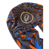 Scarf with black background, orange, and blue abstract patterns