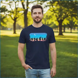 Man wearing a navy blue t-shirt with a colorful graphic design in a park