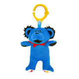 Blue teddy bear-shaped toy with a yellow clip on a white background