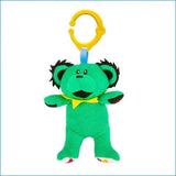 Green plush toy with a yellow clip on a white background