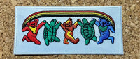 Colorful dancing bears and turtles holding hands in a row on a light blue patch.