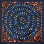 Spiral pattern bandana with dancing skeleton designs in blue, yellow and orange tones.