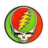 Circular enamel pin featuring the iconic grateful dead skull design with a vibrant red and green background, accented by a bold yellow lightning bolt across the forehead.