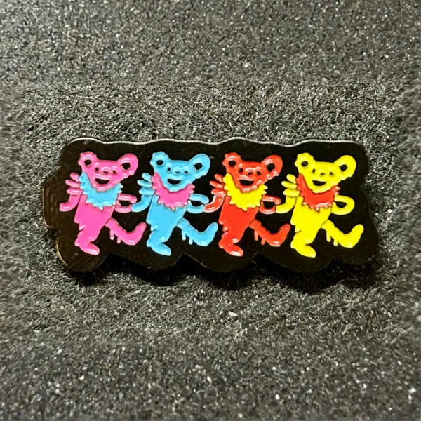 black lapel pin with colorful dancing bears