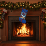 Blue Christmas stocking hanging above a fireplace with stockings on either side.