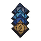 Set of four black bandanas featuring the grateful dead lightning bolt skull design in varying shades of blue and gold.