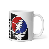 White mug with Grateful Dead design.