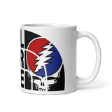 White mug with Grateful Dead design.