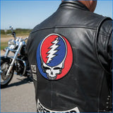 Black leather vest featuring a prominent embroidered patch with the iconic grateful dead skull and lightning bolt design in red, white, and blue.