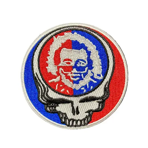 Circular patch with a skull design in red, white, and blue on a dark background