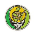 Circular patch with a turtle and shell design on a textured black background