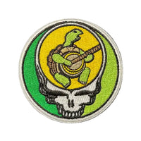 Circular patch with a turtle and shell design on a textured black background
