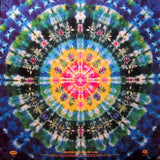 Tie-dye pattern with a colorful spiral design on a blue background