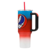 Insulated travel mug featuring the Grateful Dead ’Steal Your Face’ skull logo on a red and blue gradient background.