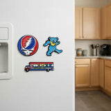 Blue dancing bear magnet with yellow collar and red, white, and blue bus-shaped magnet below it.
