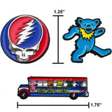 The grateful dead enamel pins feature a circular red and blue skull with a white lightning bolt, a dancing blue bear in yellow collar, and a colorful bus adorned with rainbow bears.