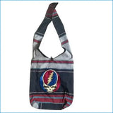 A striped shoulder bag featuring a prominent circular embroidered grateful dead logo with red, blue, and white colors.