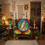 A vibrant, tie-dye throw blanket featuring the iconic grateful dead lightning bolt skull design in rainbow hues.