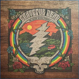 Wooden box with Grateful Dead logo, rainbow, and nature scene on a wooden background